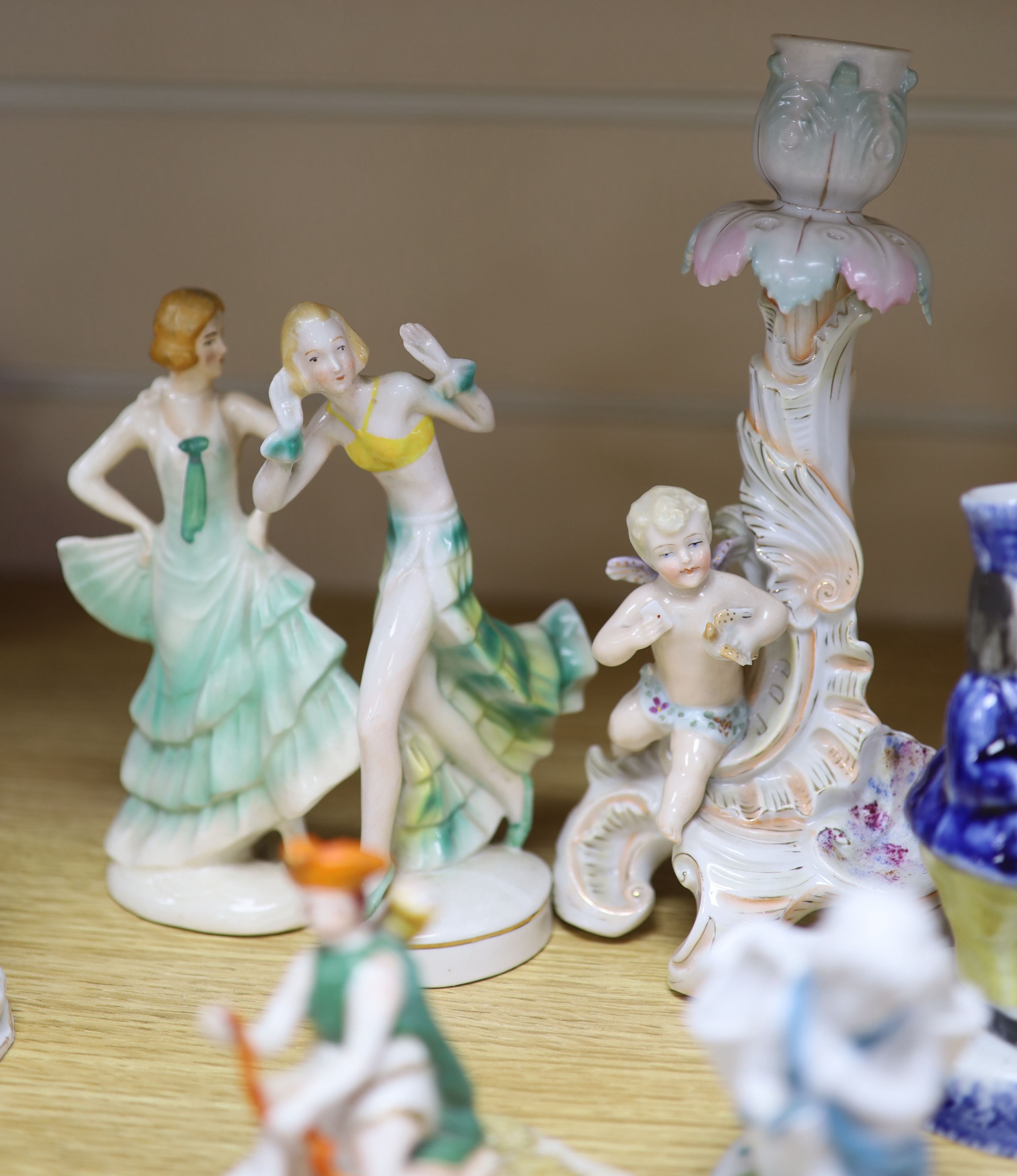 A collection of Art Deco ceramic dancing ladies, a 19th century figural box, a candlestick and a Toby jug, etc., tallest 22cm